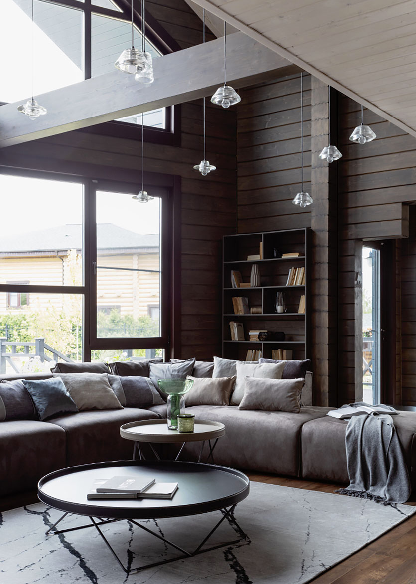 Design wnętrza domu z bali z wykorzystaniem naturalnych materiałów i minimalistycznego podejścia.