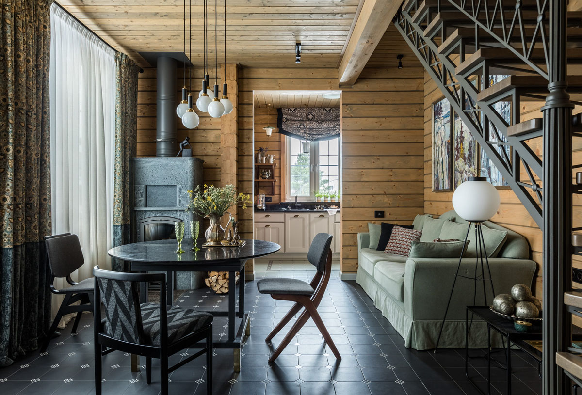 Wnętrze domu z bali w stylu skandynawskim, charakteryzujące się jasnymi kolorami i naturalnym światłem.