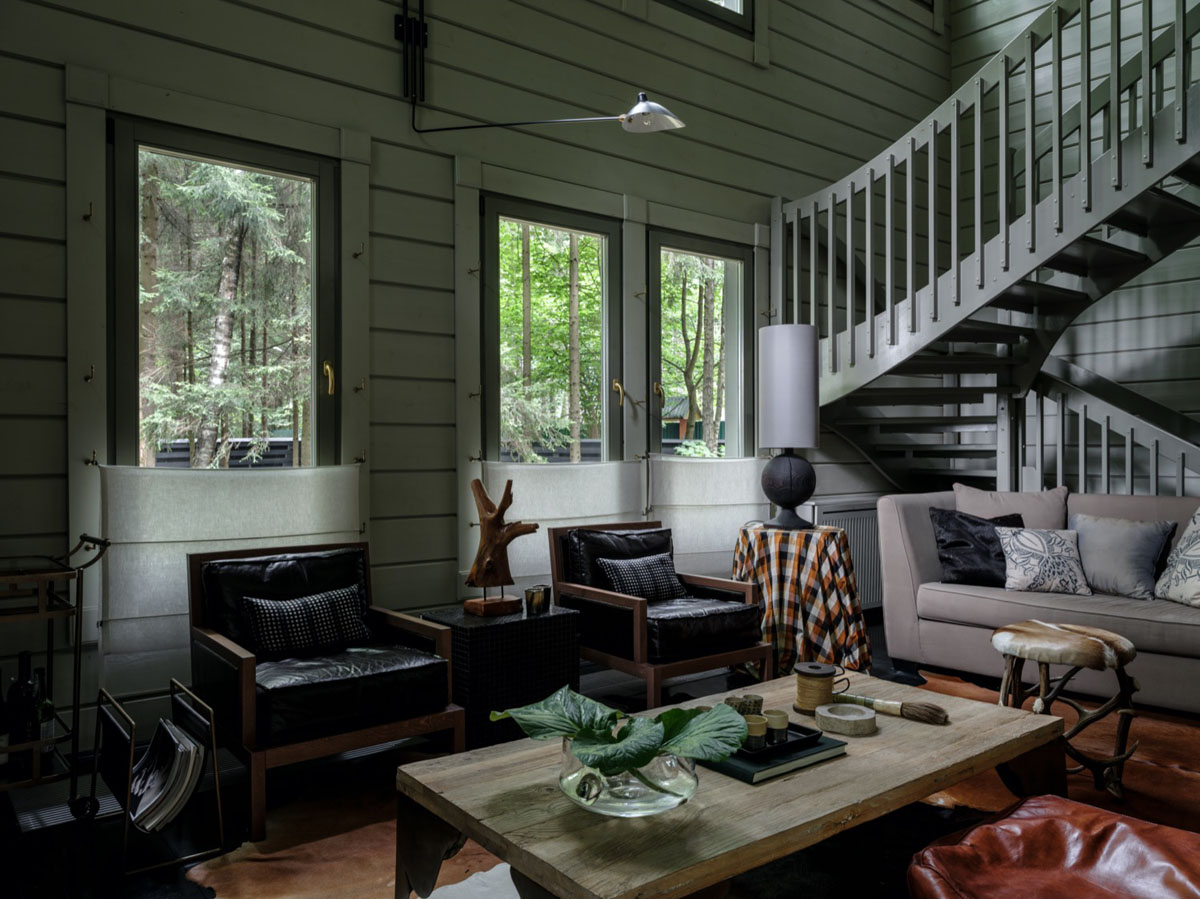 Stylowy dom z bali: Minimalizm i naturalne materiały w nowoczesnej aranżacji wnętrza.