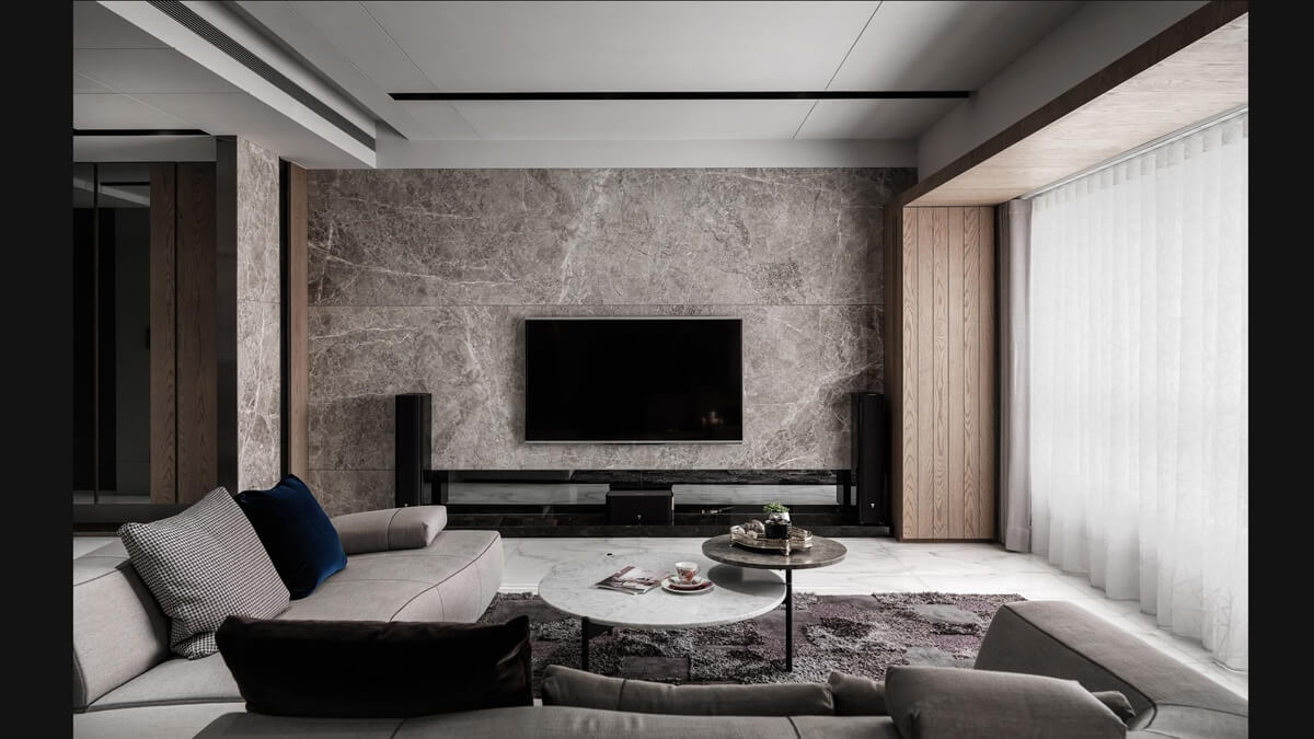 Szarość z Akcentami Salon w odcieniach szarości z żywymi akcentami kolorystycznymi, ożywiającymi wnętrze.