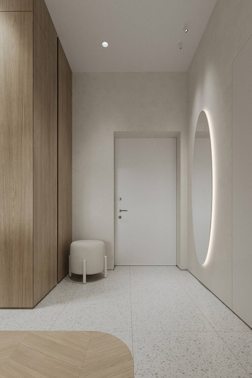 Kącik do czytania w kremowych tonach z plecionym fotelem i lampą.