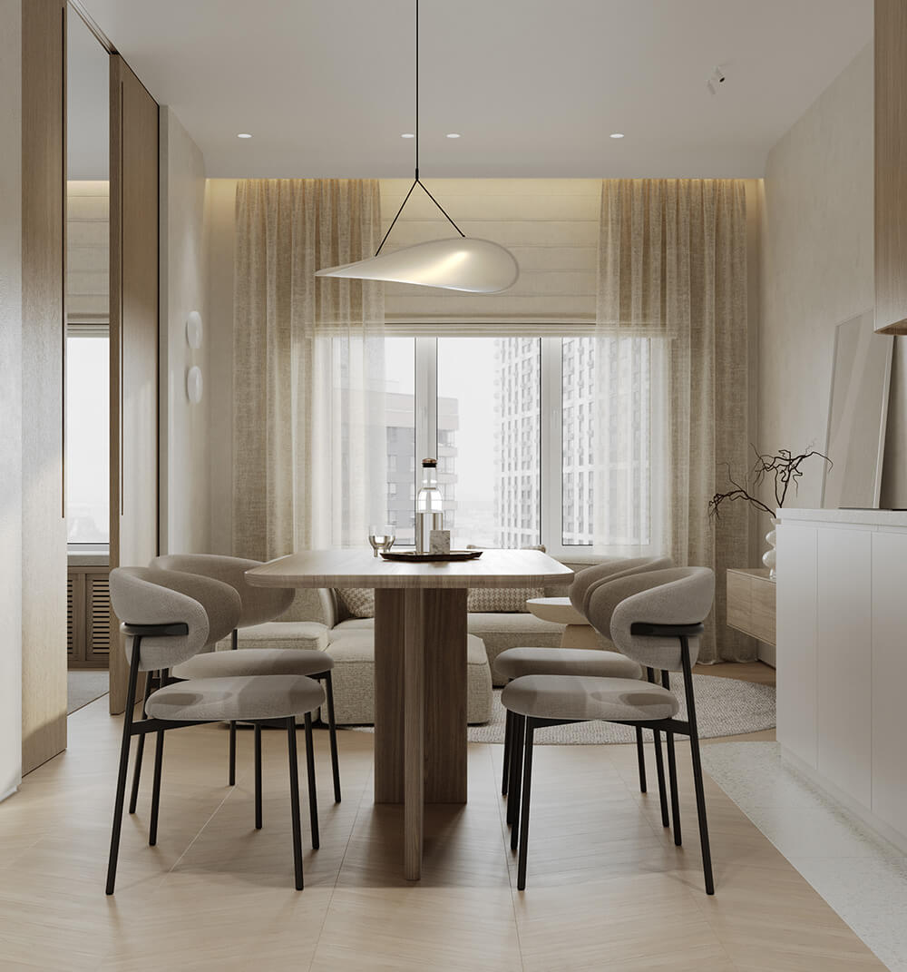 Kremowa kuchnia z drewnianymi szafkami i jasnym blatem – idealne połączenie kolorów.