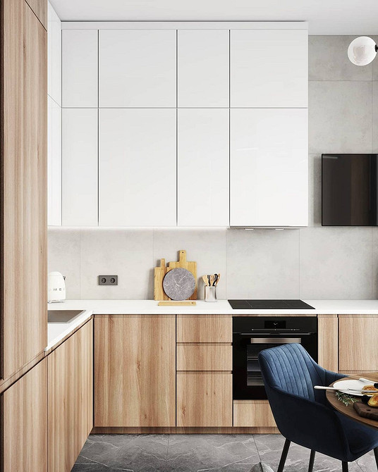 Minimalistyczna biała kuchnia Nowoczesny design białej kuchni z minimalistycznymi szafkami i wyspą kuchenną.