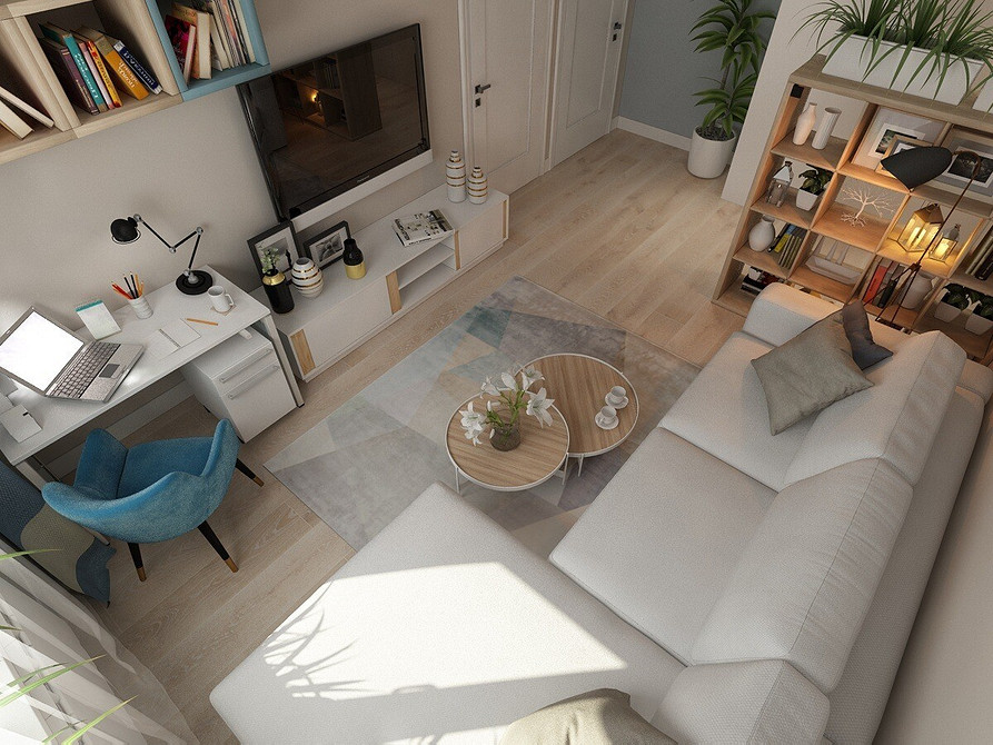 Biała sofa narożna Narożna biała sofa w salonie z dużymi oknami i widokiem na miasto.
