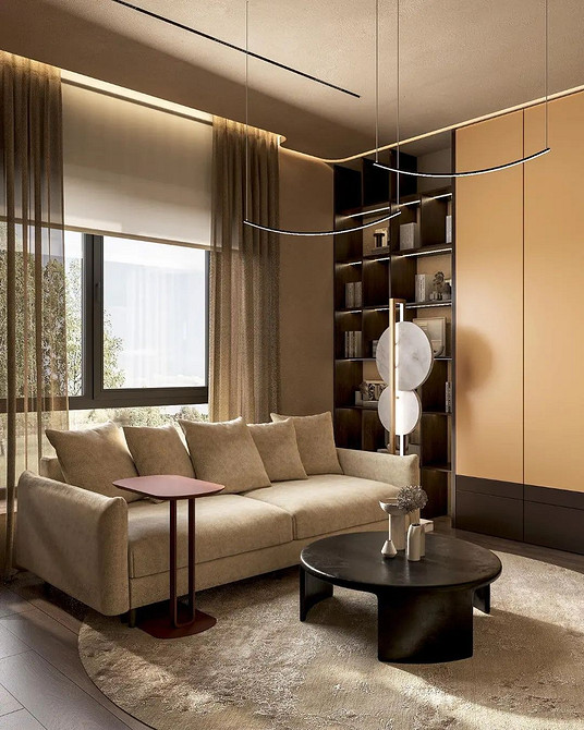 Luksusowa beżowa sofa welurowa ze złotymi nóżkami w eleganckim salonie.