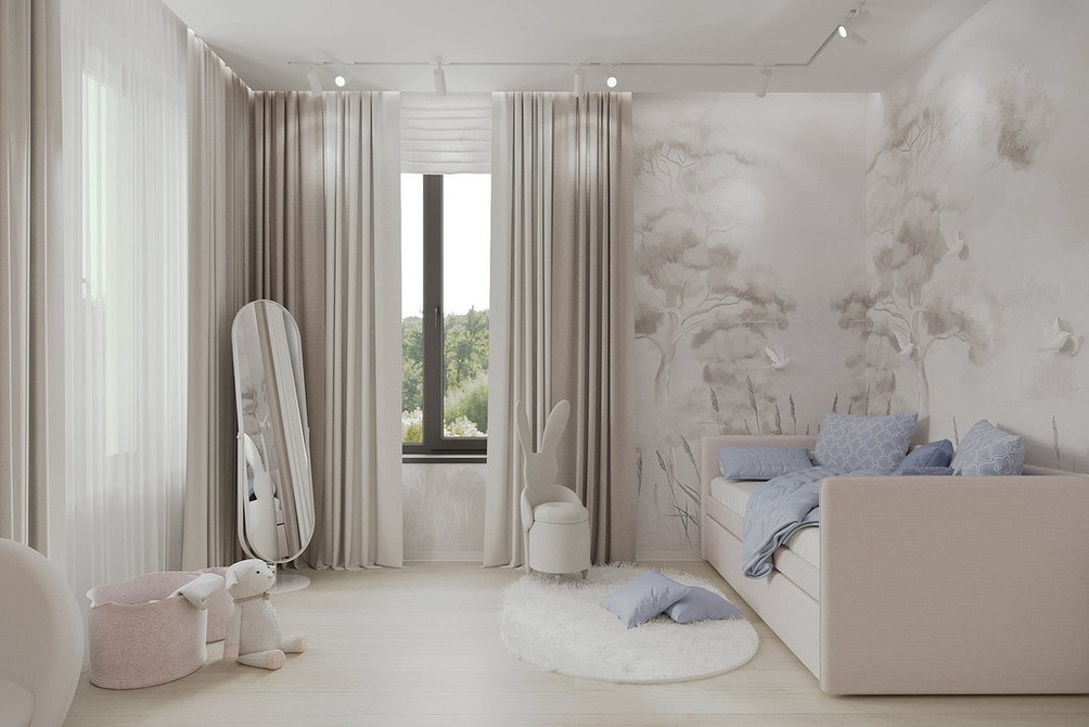 Pokój dziecięcy z beżową sofą i zabawkami tworzący przytulną przestrzeń do zabawy.