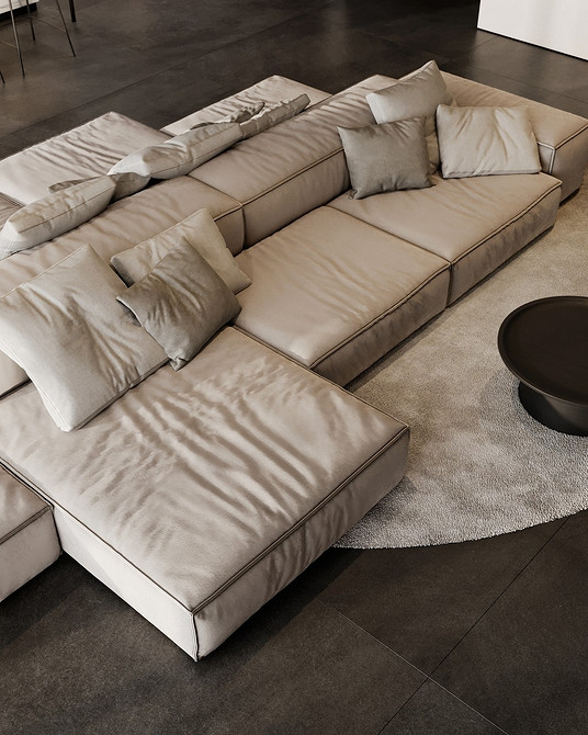 Beżowa sofa z tkaniny w eklektycznym wnętrzu z jasnymi detalami.