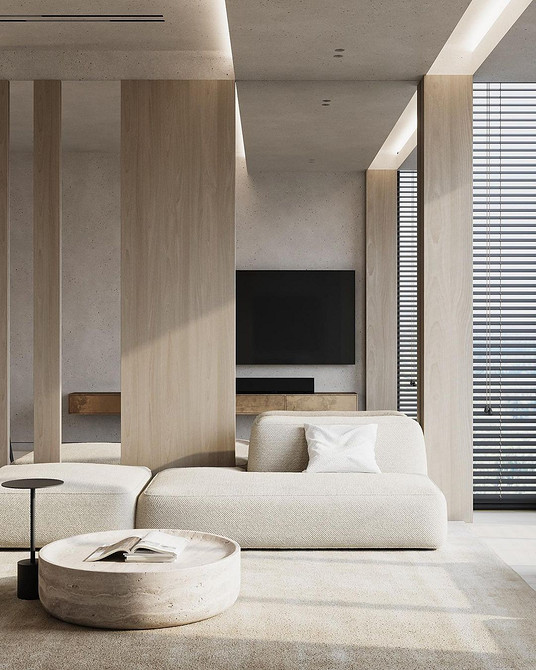 Beżowa skórzana sofa w klasycznym wnętrzu z dywanem i dekoracjami.