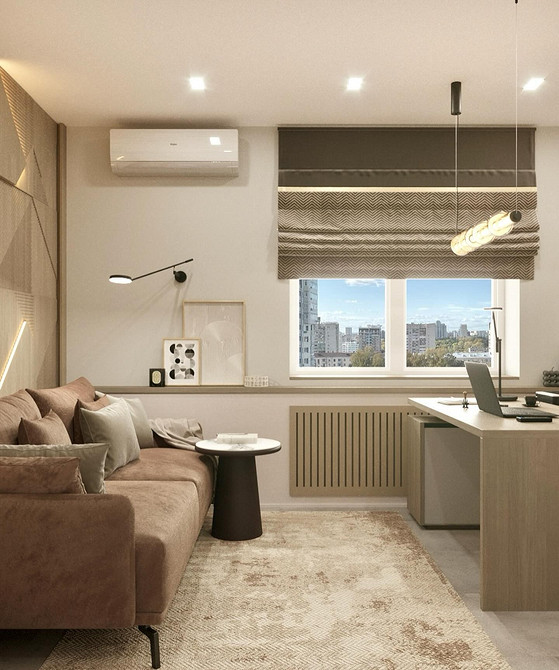 Minimalistyczne wnętrze z beżową sofą i białymi ścianami, podkreślone czarnymi akcentami.