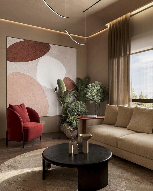 Elegancka beżowa sofa narożna w jasnym salonie z dużymi oknami.