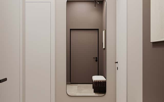 Skandynawska kuchnia z białymi frontami, drewnianymi blatami i minimalistycznym wyposażeniem.