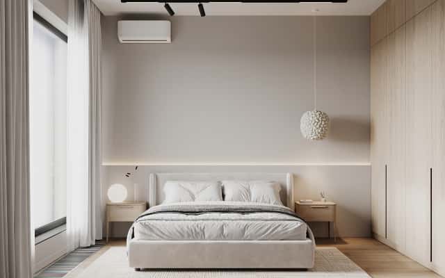 Jasne wnętrze w stylu skandynawskim z minimalistycznymi dodatkami i naturalnym światłem.