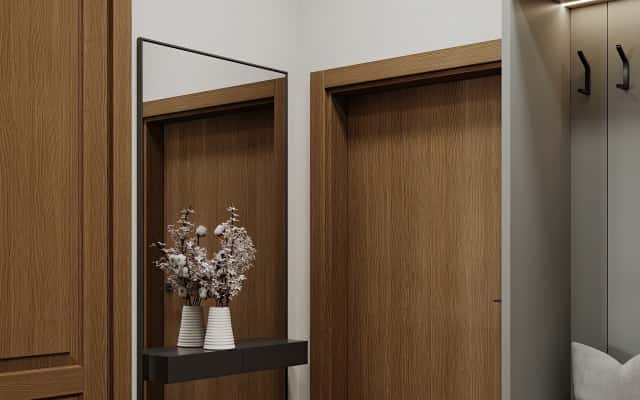 Nowoczesny design wnętrza małego mieszkania z wykorzystaniem jasnych kolorów i naturalnych materiałów.