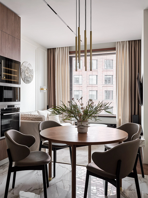 Komfort i ciepło Przytulna kuchnia z salonem: miękkie dywany i tekstylia dodają komfortu i ciepła.