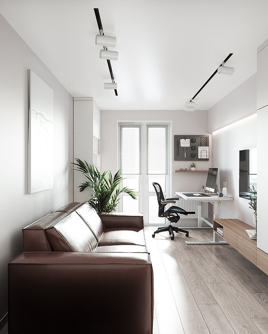 Duża, brązowa sofa w minimalistycznym wnętrzu. Akcent na funkcjonalność i komfort.