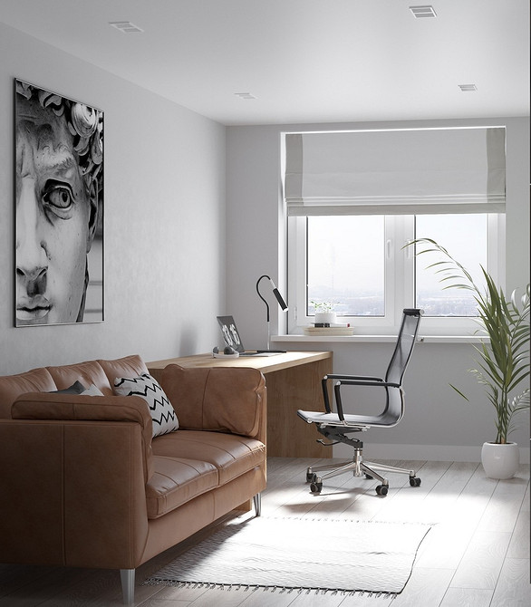 Brązowa sofa z drewnianymi podłokietnikami w stylu skandynawskim. Jasne wnętrze.