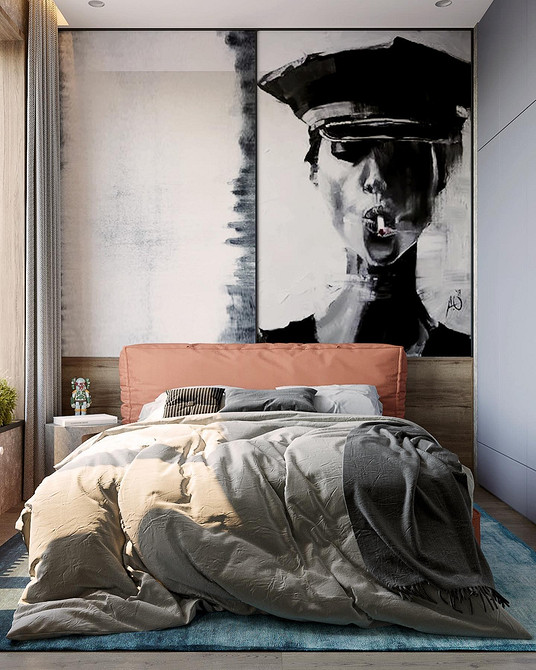 Elegancki miękki zagłówek łóżka obity welurem w głębokim, granatowym kolorze.