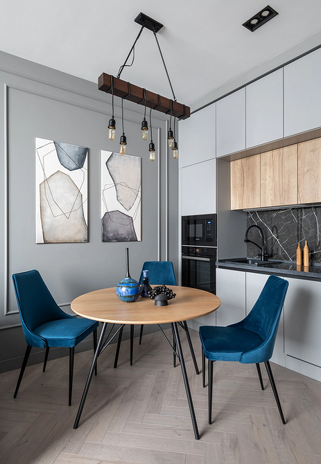 Okrągły stół w minimalistycznym wnętrzu - porady dotyczące wyboru kształtu stołu.