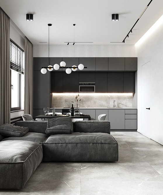 Szary narożnik Szary narożnik w salonie zapewnia dużo miejsca dla całej rodziny. Szare meble.