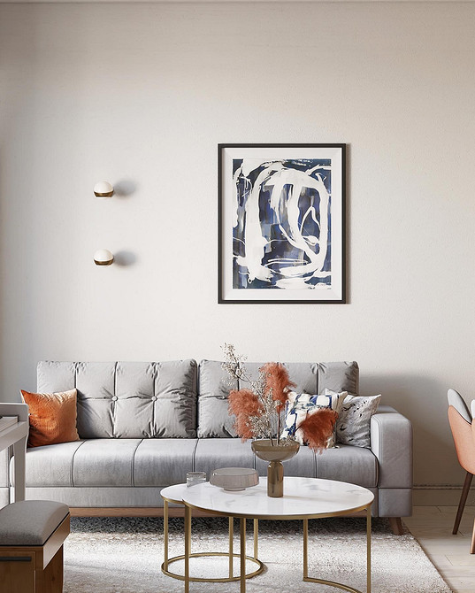 Szary kącik Przytulny kącik z szarą sofą, pledem i półką z książkami. Idealne do małego mieszkania.