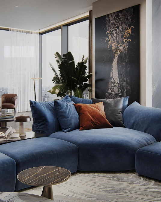 Wnętrze z niebieską sofą i drewnianymi elementami. Harmonia kolorów w aranżacji.