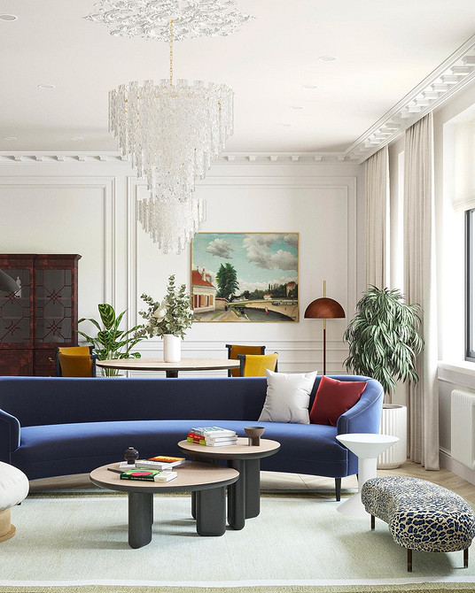 Sofa i biblioteczka Aranżacja wnętrz z niebieską sofą i biblioteczką: przytulny kącik do czytania.