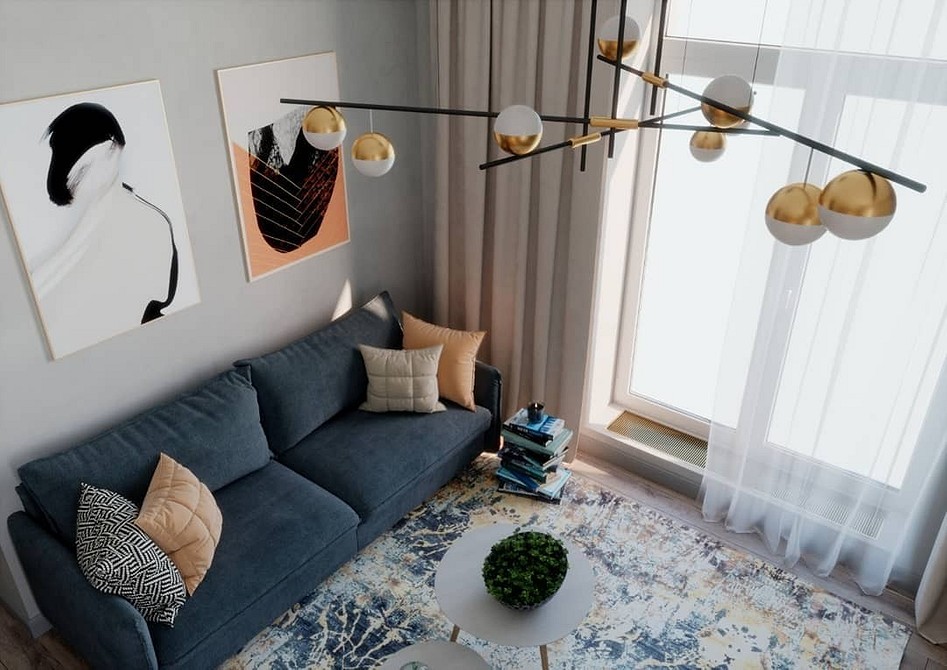 Minimalizm sofy Niebieska sofa w minimalistycznej aranżacji wnętrz: białe ściany i drewniana podłoga.