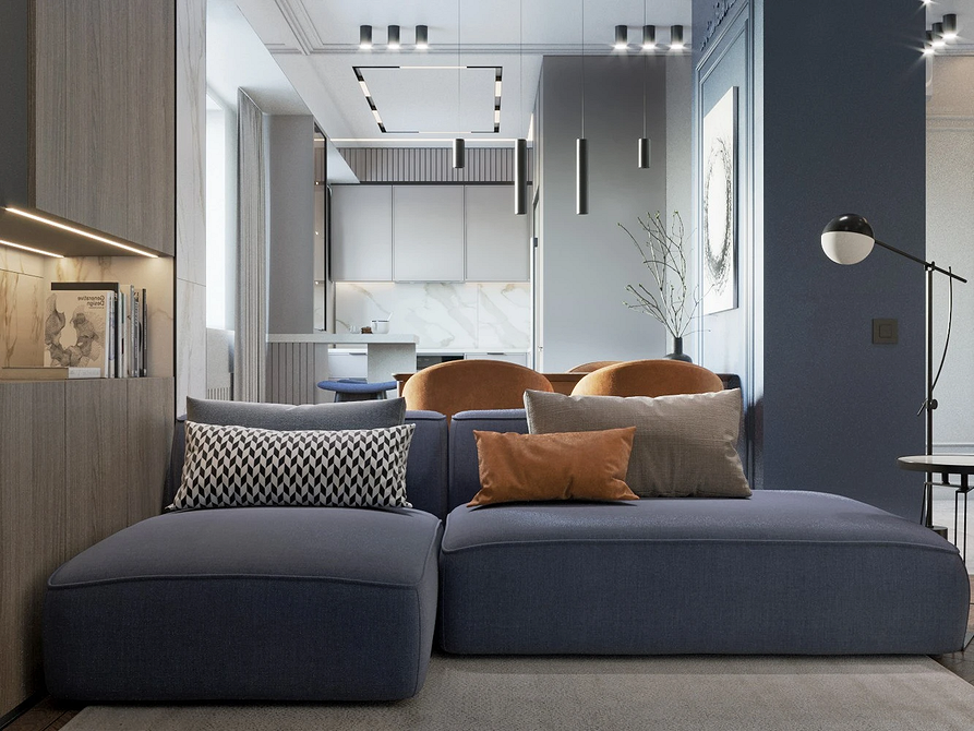 Stylowy salon z niebieską sofą. Akcent kolorystyczny w nowoczesnym wnętrzu 2026.