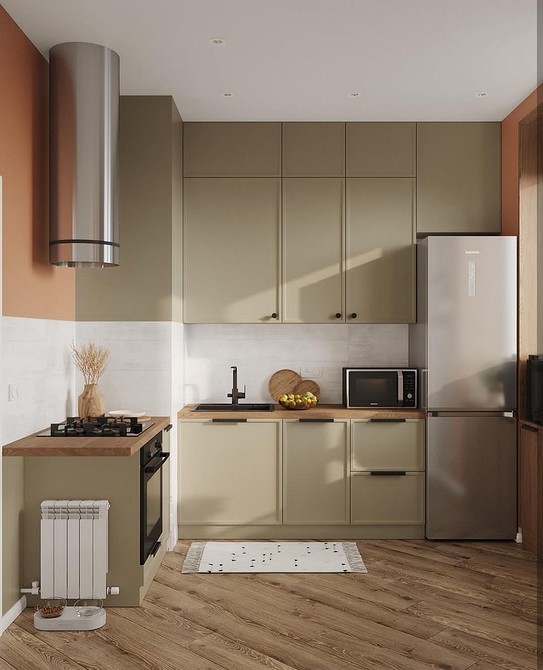 Jasna kuchnia z drewnianym blatem, który harmonijnie współgra z wnętrzem.