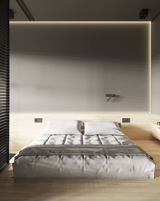 Minimalistyczna sypialnia z łóżkiem na podium i wbudowanym miejscem do przechowywania.
