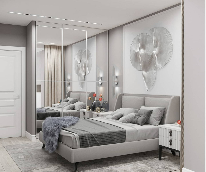 Łóżko na podium z wbudowanym oświetleniem tworzącym przytulną atmosferę.