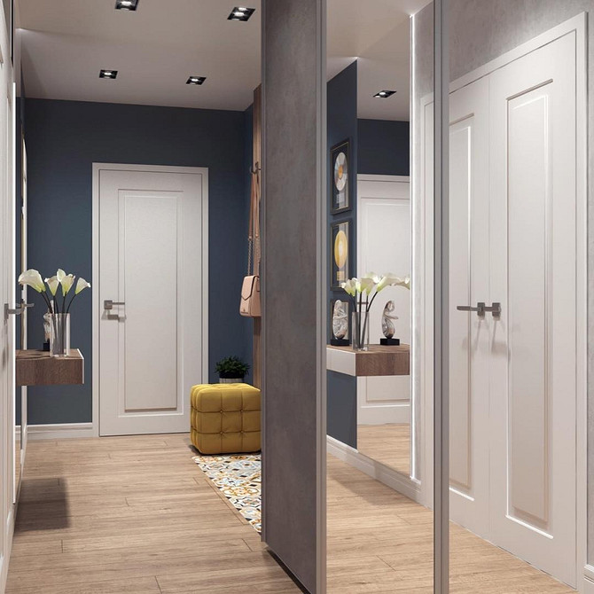 Szafa lustrzana z podświetleniem w salonie, nowoczesny design i dodatkowe źródło światła.