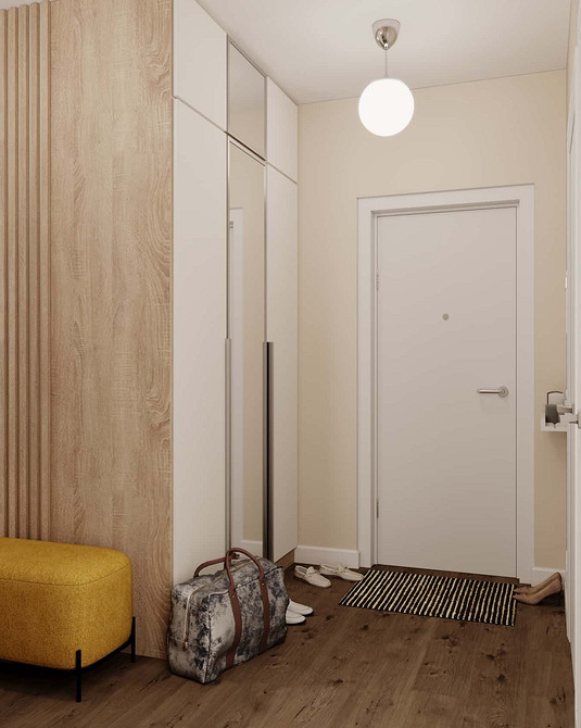 Elegancka szafa z lustrem w salonie odbija światło, dodając blasku wnętrzu.