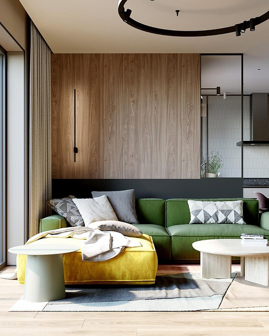 Przytulna zieleń Zielona kanapa w aranżacji z tekstyliami i poduszkami. Przytulne wnętrze mieszkania.