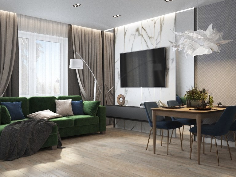 Przytulna zieleń Przytulny salon z zieloną kanapą, poduszkami i ciepłym oświetleniem. Skandynawski styl.