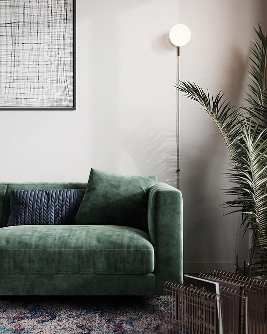 Skandynawska zielona sofa Zielona sofa w stylu skandynawskim z drewnianymi nóżkami i tekstylnymi poduszkami, nadająca lekkości.