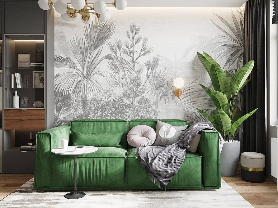 Design salonu z jasnozieloną sofą, dywanem i dekoracyjnymi roślinami w 2026.