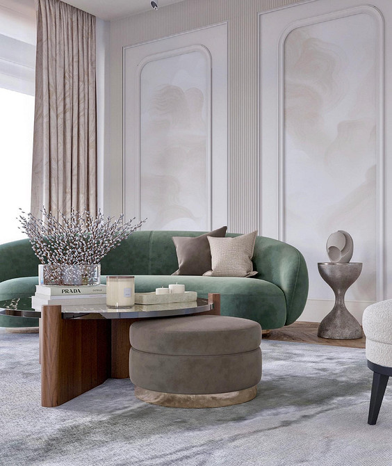 Salon z zieloną sofą, białymi ścianami i jasnymi elementami dekoracyjnymi w 2026.