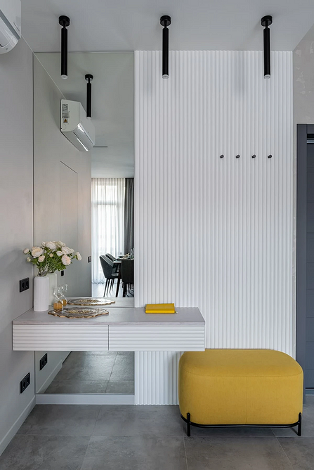 Panele gipsowe 3D imitujące kamień, rustykalny wygląd ściany w salonie.