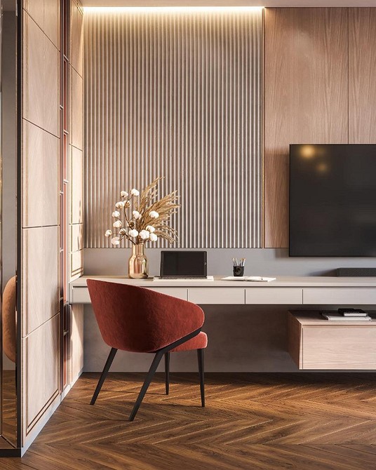 Salon z telewizorem i ścianą pokrytą panelami gipsowymi 3D poprawiającymi akustykę.